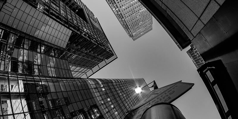 Looking up at a view to the top of high-rise buildings