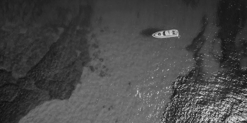 Aerial view of luxury yacht sailing in the ocean