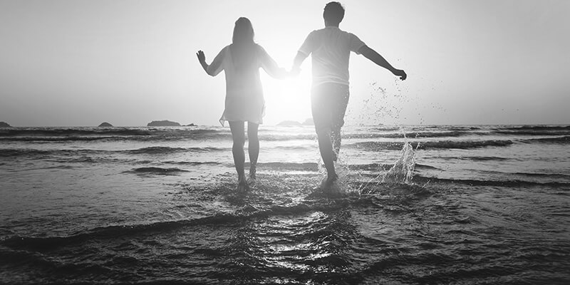 Couple frolicking in the sea