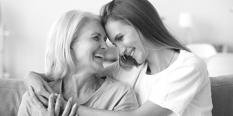 Happy embracing mother and daughter