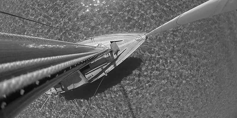 Aerial shot down the mast of a sailing boat