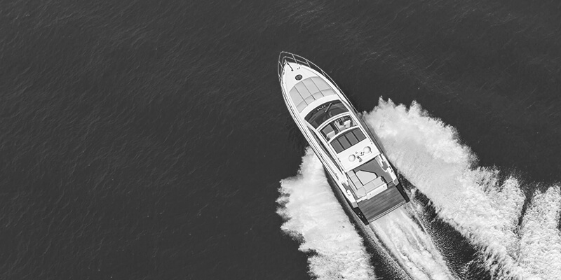 Aerial view of speedboat powering through the ocean